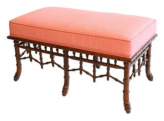 Bench with pink upholstered top over bamboo style base, height 19.5, inches, length 37.5 inches.
