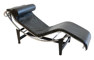 Attributed to Le Corbusier, LC4 leather chaise lounge chair, having chrome and matte base, length 63 inches.