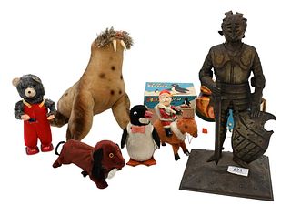 Group of Vintage Toys, to include Steiff mohair walrus, skier penguin, nunu, windup dog and bear, santa, and salesman suit of armor. 