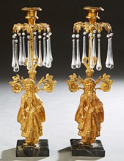 Pair of Victorian Gilt Brass Figural Girandoles, 19th c., in the "Sultana" pattern, on integral figured black marble bases, hung with bead and teardro
