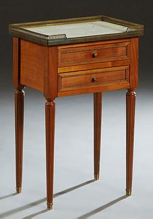 French Ormolu Mounted Carved Mahogany Marble Top Nightstand, 20th c., the 3/4 brass galleried white marble over two drawers, on turned reeded legs wit