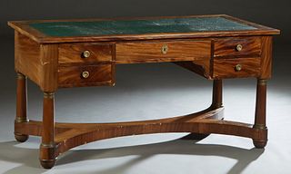 French Empire Style Carved Mahogany and Oak Desk, late 19th c., with an inset green leather writing surface over a frieze drawer flanked by two drawer