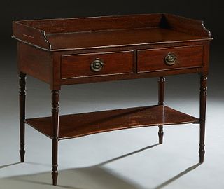 French Carved Walnut Washstand, late 19th c., the 3/4 galleried top over double frieze drawers, on turned tapered legs joined by a lower stretcher she