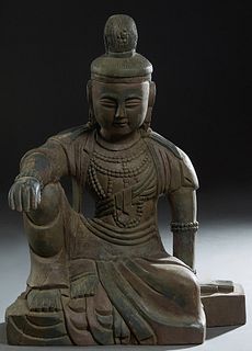 Chinese Carved Wood Seated Buddha, late 19th c., with traces of original polychromy, H.- 23 3/4 in., W.- 18 in., D.- 10 3/4 in.