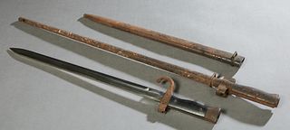 Two French Bayonets, 20th c., one with a triangular blade, with scabbard; the second a Model 1877, with a flat grooved blade, with a scabbard, Triangu