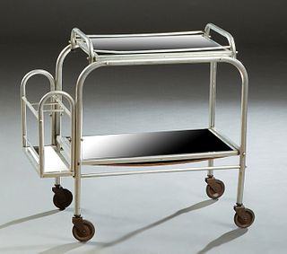 French Aluminum Dessert Cart, 20th c., the top with a lifting mirror tray over a lower mirror shelf, flanked on the rear by a bottle rack, on large wh