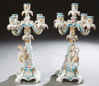 Pair of Meissen Style Five Light Porcelain Candelabra, 20th c., with a central candle cup over four scrolled candle arms, on a tapered floral mounted 