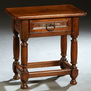French Louis XIII Style Carved Oak Nightstand, 20th c., the rectangular top over a frieze drawer, on turned tapered legs joined by a box stretcher, H.