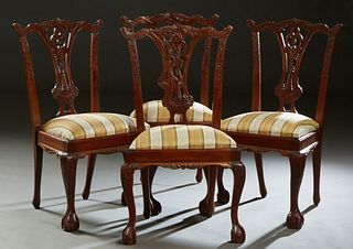 Set of Four English Carved Mahogany Chippendale Style Dining Chairs, 20th c., the serpentine crest rail over a tapered pierced back splat, above a tra