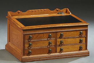 American Carved Oak Tabletop Desk, c. 1900, the 3/4 galleried back over an iron inkwell with glass insert, behind a slanted inset leather writing surf