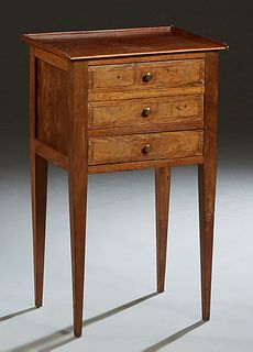French Carved Walnut Louis XVI Style Nightstand, 20th c., the three-quarter galleried top over a bank of three drawers, on tapered square legs, H.- 20