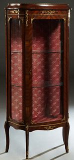 French Louis XV Style Ormolu Mounted Carved Mahogany Curved Glass Vitrine, 20th c., the ogee top over a curved glazed center door flanked by curved si