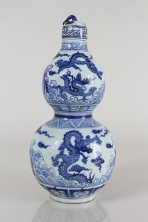 A Chinese Lidded Blue and White Detailed Dragon-decorating Porcelain Vase 
