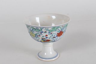 A Chinese Porcelain Fortune Cup