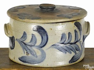 Pennsylvania stoneware lidded cake crock, 19th c., with cobalt floral decoration, 5 3/4'' h., 9'' w.