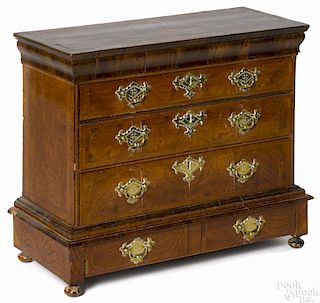 Miniature George II walnut veneer chest on frame, early 18th c., with a geometric line inlaid top