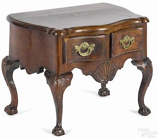Miniature George III walnut dressing table, mid 18th c., with a serpentine front and ovolo corners