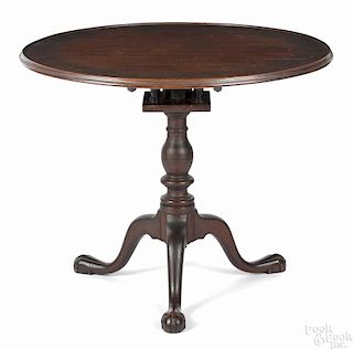 Pennsylvania Chippendale walnut tea table, ca. 1770, with a birdcage support, a baluster standard