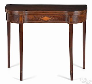 Federal mahogany card table, ca. 1800, with a concave front, with line and diamond inlays