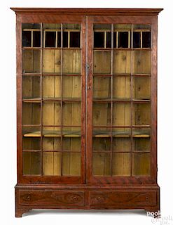 Rare New England painted pine china cupboard, early 19th c., retaining its original red and black