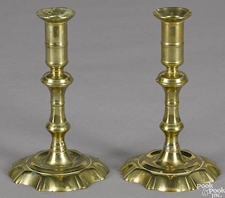 Pair of Queen Anne brass scallop base candlesticks, ca. 1760, 7 1/4'' h.