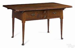 Pennsylvania walnut tavern table, ca. 1780, with a rare notched corner top, 29 3/4'' h., 53 3/4'' w.