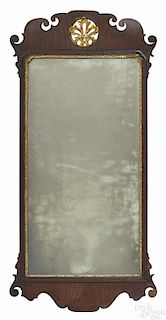 Large Chippendale mahogany looking glass, late 18th c., with a parcel gilt plume crest, 50'' h.