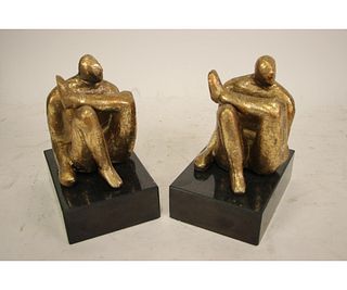 PAIR OF AMADEO SITTING STATUES