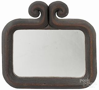 Tramp art carved mirror, ca. 1900, with a scrolled crest, overall - 20'' x 22''.