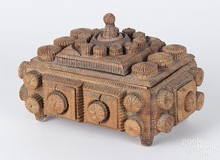 Tramp art carved trinket box, ca. 1900, with repeating applied circular tiers, 5 1/2'' h., 8 1/2'' w.
