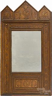 Tramp art carved mirror, ca. 1900, with heart and snowflake decoration, overall - 39 1/2'' x 23 3/4''.
