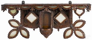 Tramp art carved and mirrored shelf, dated 1920 in relief, initialed PM, 15 1/2'' h., 37'' w.