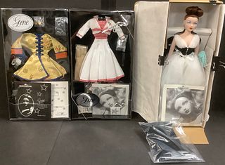 Gorgeous Red Haired Gene Doll which also has (2) of her outfits. Gene is wearing a a very pretty white dress with black corset and another black cape 