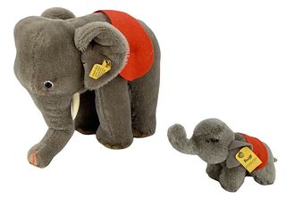 Lot of (2) Steiff Elephants including 8" grey Elephant 1968-1976 and 4 1/2" grey Elephant 1968-1977. Both are ear tagged.