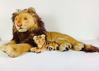 (2) Vintage Steiff mohair reclining animals. Includes 9" long tiger with airbrushed stripes, glass eyes, applied ears, stitched nose and mouth; and 25