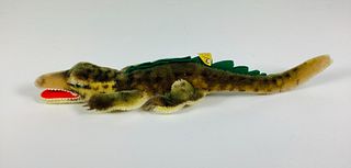 Vintage Steiff Alligator. 14" long unjointed mohair with glass eyes, open mouth with wool felt "teeth". Retains button and tag.