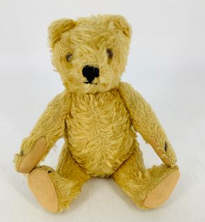 Vintage Teddy Bear likely Steiff. 9" gold mohair bear, disk jointed at neck, shoulders and hips,glass eyes, stitched nose, felt paw pads. No button or