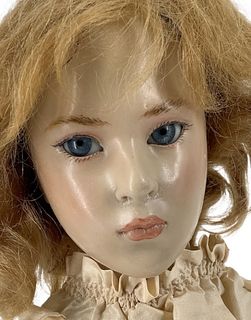Wax over porcelain "Marija" by doll artist Brigitte Deval. 19 1/2" shoulder head doll with mohair wig, inset glass eyes, closed mouth, on cloth body w