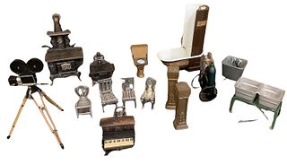 Lot of 16 pieces miniature dollhouse furniture mostly made out of metal. One of the columns has a piece broken off.