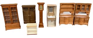Lot of 7 pieces miniature dollhouse furniture in different wood tones. Made out of wood and plastic with some items made by BESPAQ.