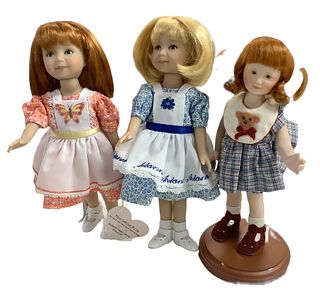 Lot of 3 dolls, 2 of which are by Dianna Effner in hard vinyl. Blonde doll has pinafore identifying her as Arianna. Redhead doll has manufacturerÃ­s h
