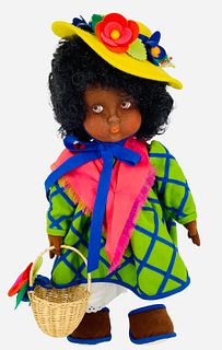 17 1/2" Floria by Anili has a pressed felt face with dark brown side glancing painted eyes with black curly wig. She is in a box, no COA.