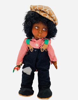 17 1/2" Scavini black boy by Anili has a pressed felt face with dark brown side glancing painted eyes with black curly wig. He is in a box, no COA.