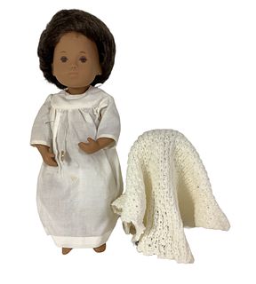 12" vinyl Sasha Black Baby Girl in Nightdress and blanket (501) w/tag (not attached) and box, stain on front of dress. Box has rips (been taped) shelf