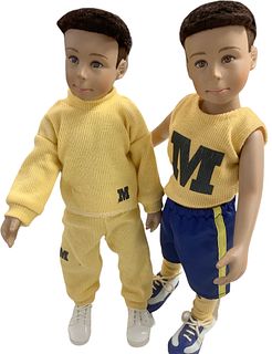 Lot of 2 approx 12" hard vinyl sports themed boy dolls with Michigan inspired apparel and painted faces.