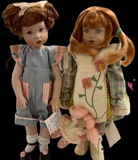 Lot of 2 Kish & Co hard vinyl dolls @ approx 11" tall. Redhead doll has extra baby doll she carries and is circa 2003. Her pinafore is felt and she re