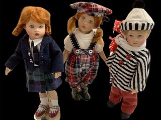 Lot of 3 Kish & Co hard vinyl dolls @ approx 8" tall. The little redhead has jointed knees. There are lady bug details on the black/white striped outf