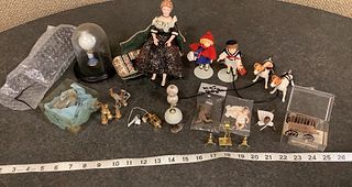 Lot of dollhouse accessories, including bisque doll on settee, bisque dogs, and several lamps.