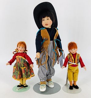 Lot of 3 dolls including a Kish & Co doll in a western theme outfit @ 12" tall w/manufacturerÃ­s hangtag identifying doll as Jesse circa 1994/95. Othe