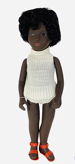 16" vinyl Sasha Black Girl Cora (109) w/tag, has painted facial features and is in good condition. Box has tears, rips, shelf wear and no cellophane.